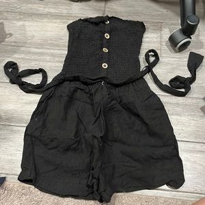 Strapless black romper with tie waist
